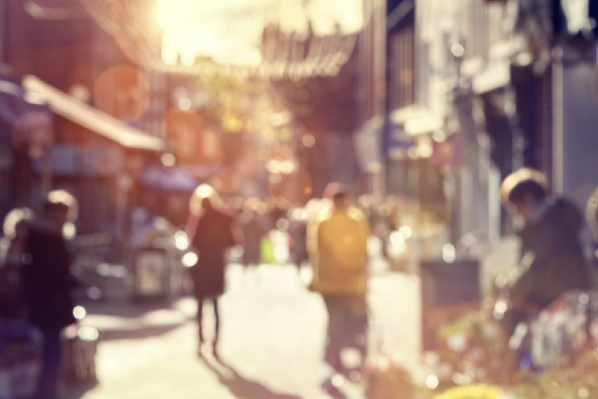 Crowd of shoppers walking and shopping on a high street